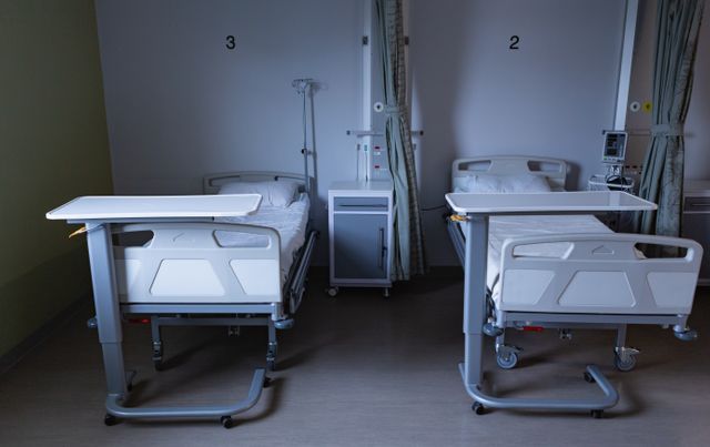 Modern hospital ward with empty beds