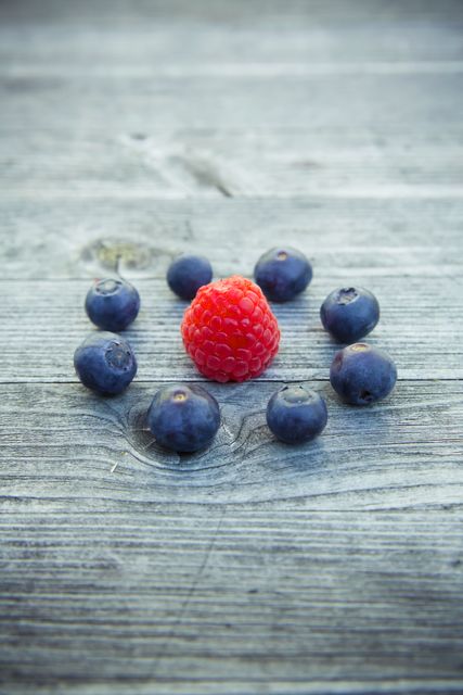 Raspberry Beside Blueberries - Download Free Stock Photos Pikwizard.com