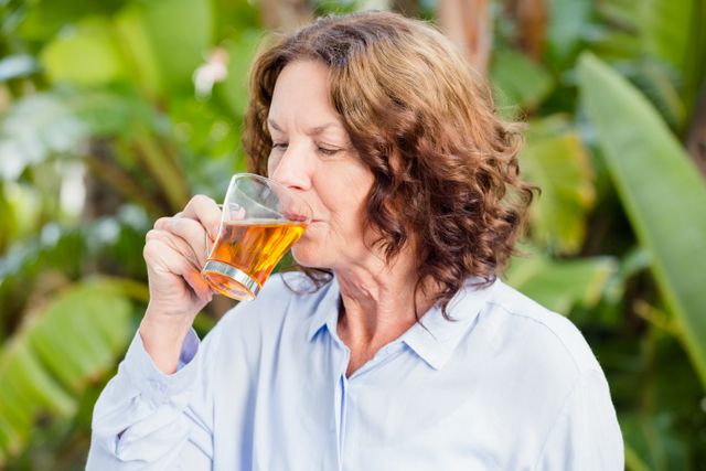 Mature woman drinking herbal tea  - Download Free Stock Photos Pikwizard.com