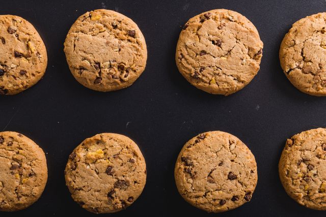 Directly above shot of cookies arranged on black background, copy space. unaltered, food, studio shot and snack.