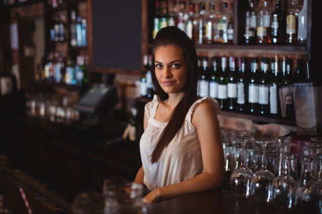 Portrait of beautiful female bar tender - Download Free Stock Photos Pikwizard.com