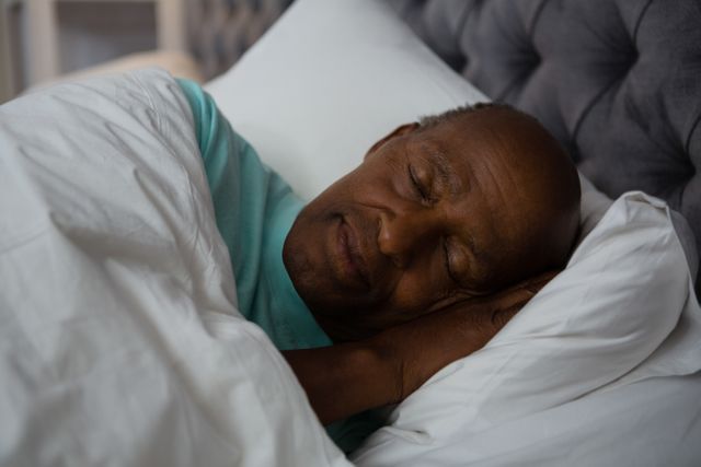Senior man sleeping on bed - Download Free Stock Photos Pikwizard.com