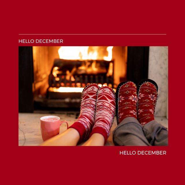 Composition of hello december text over christmas socks. Christmas, winter and celebration concept digitally generated image.