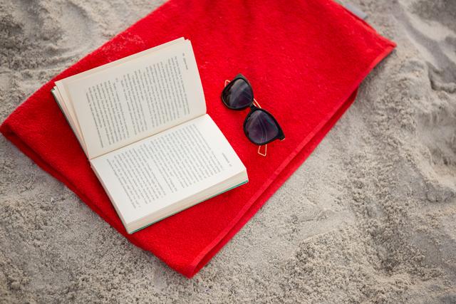 Open book and sunglasses kept on red napkin - Download Free Stock Photos Pikwizard.com