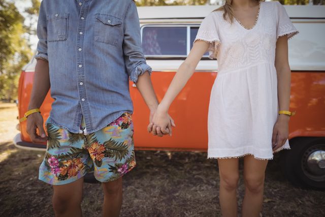 Couple holding hands against van - Download Free Stock Photos Pikwizard.com