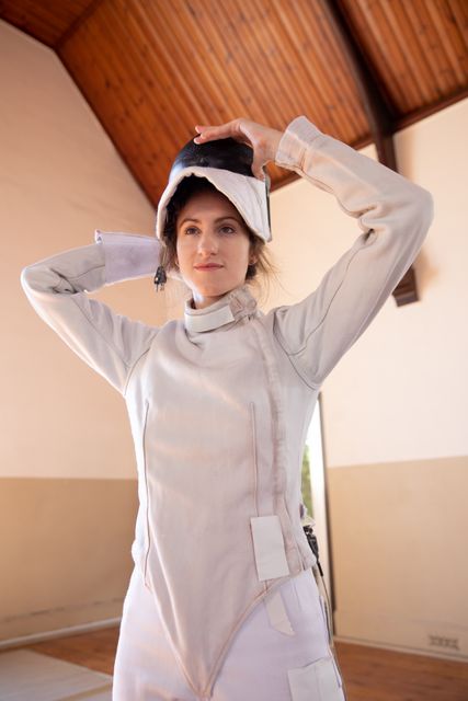 Woman wearing protective fencing clothes - Download Free Stock Photos Pikwizard.com