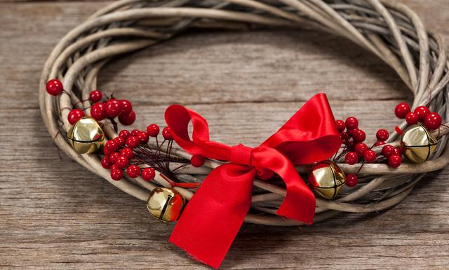Close-up of grapevine wreath with red ribbon - Download Free Stock Photos Pikwizard.com