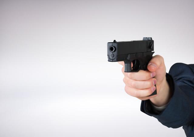Hand holding gun with white background - Download Free Stock Photos Pikwizard.com
