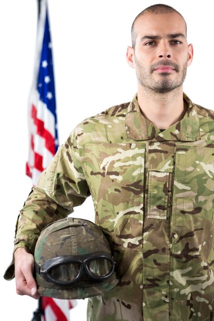 Portrait of smiling soldier standing with combat helmet - Download Free Stock Photos Pikwizard.com