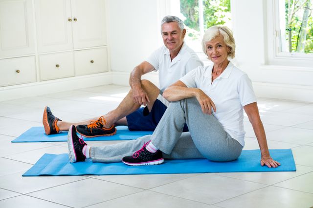 Portrait of senior couple exercising on mat - Download Free Stock Photos Pikwizard.com