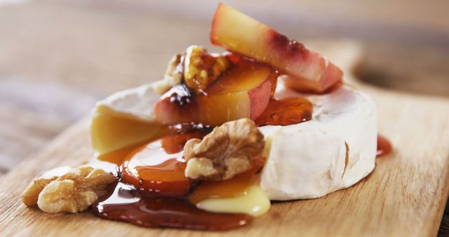 Caramelized peaches and honey-topped brie with walnuts offer a rich gourmet treat. - Download Free Stock Photos Pikwizard.com