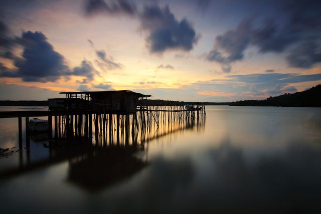 Silhouette of Wooden House and Walkbridge on Water - Download Free Stock Photos Pikwizard.com