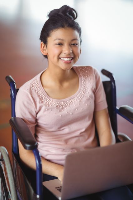 Portrait of disabled schoolgirl using laptop in campus - Download Free Stock Photos Pikwizard.com