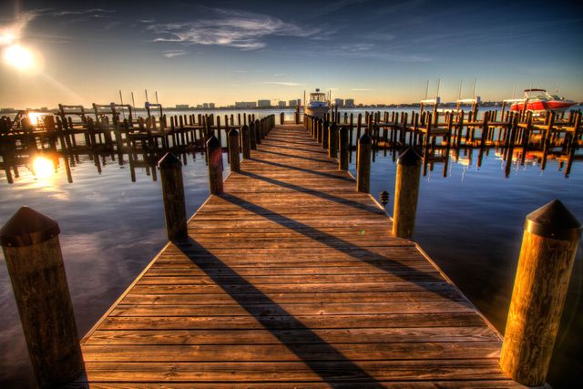 Brown Wooden Dock on Blue Water Under White Clouds and Blue Sky during Daytime - Download Free Stock Photos Pikwizard.com