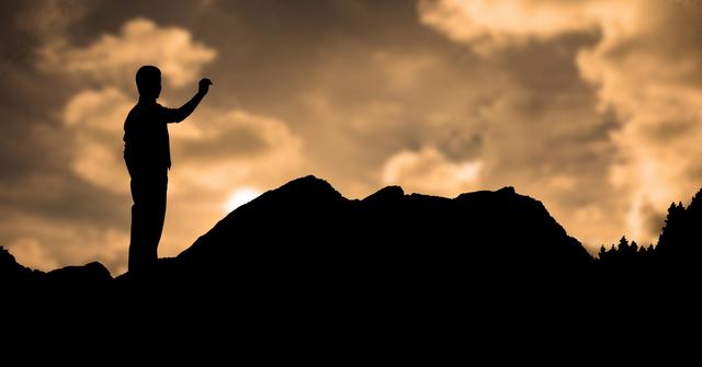 Silhouette man standing on mountain during sunset - Download Free Stock Photos Pikwizard.com