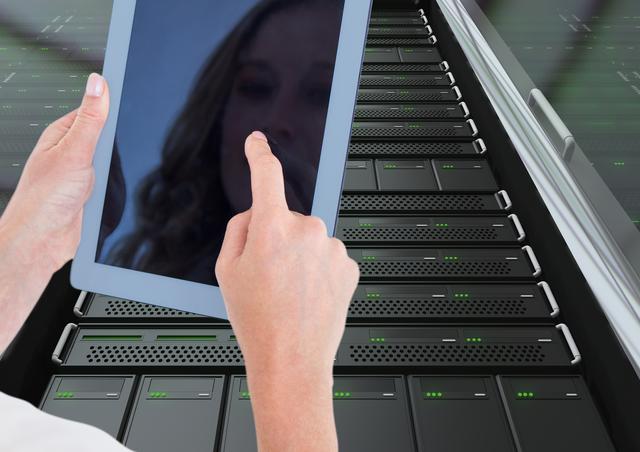 Woman using digital tablet against server room background - Download Free Stock Photos Pikwizard.com