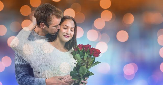 Loving man kissing woman holding roses over bokeh - Download Free Stock Photos Pikwizard.com