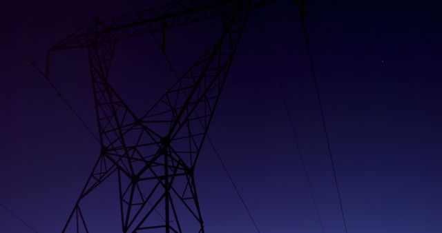 Low angle view of high voltage electric pole during sunset 4K 4k