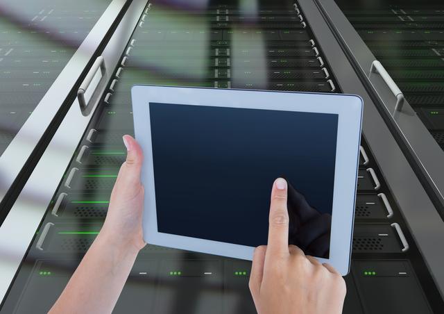 Hands of technician using digital tablet in server room - Download Free Stock Photos Pikwizard.com