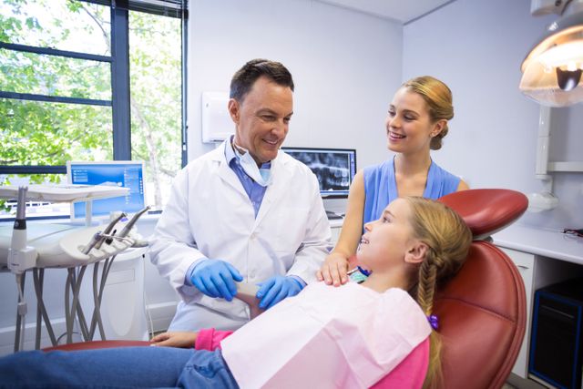 Dentist interacting with young patient - Download Free Stock Photos Pikwizard.com