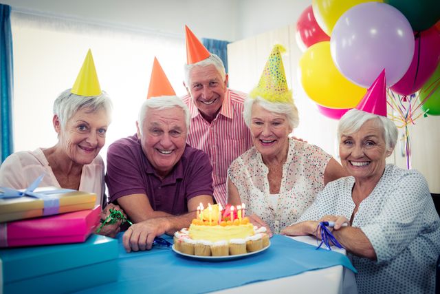 Group of seniors celebrating a birthday - Download Free Stock Photos Pikwizard.com