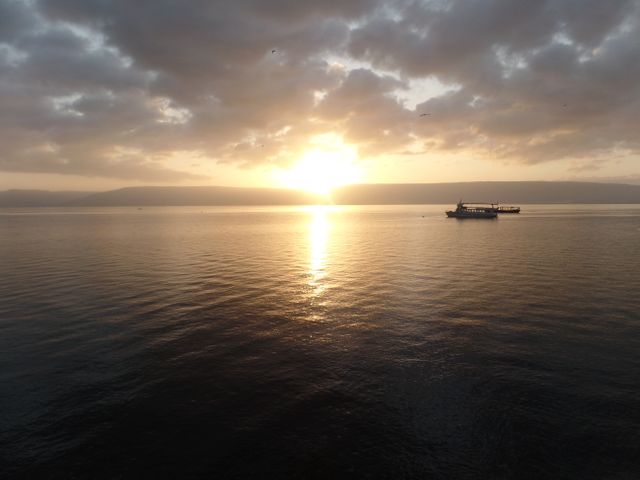 the sun setting over the sea of galilee - Download Free Stock Photos Pikwizard.com