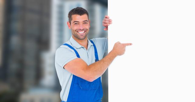 Worker pointing at blank bill board - Download Free Stock Photos Pikwizard.com