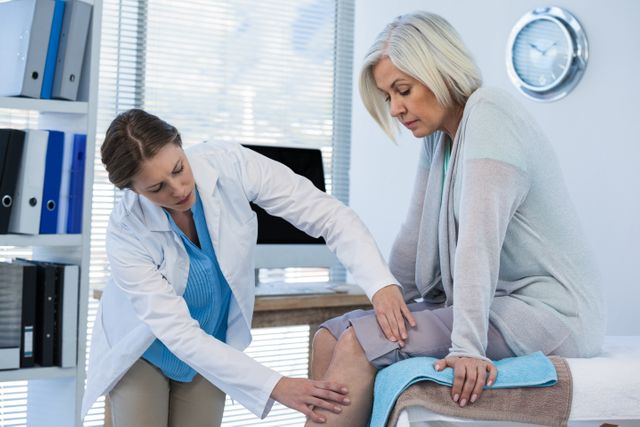 Doctor examining patient knee - Download Free Stock Photos Pikwizard.com