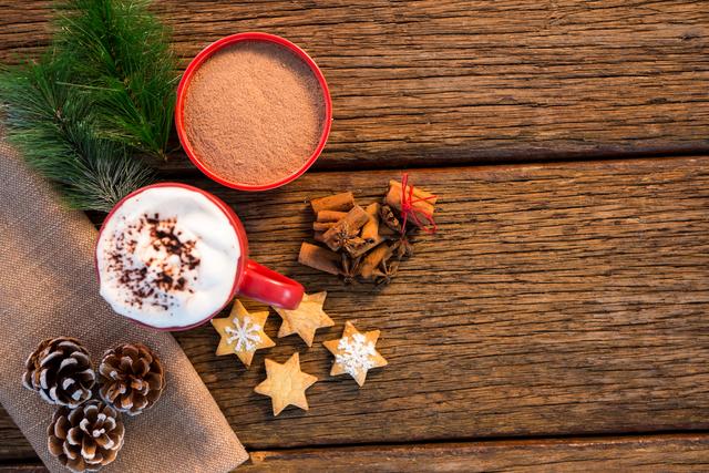 Pine cone, coffee cup, sweet food, cinnamon and christmas fir with napkin - Download Free Stock Photos Pikwizard.com