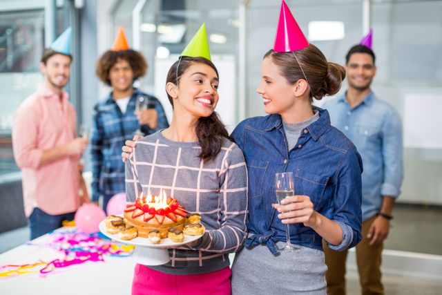 Happy executives celebrating their colleagues birthday - Download Free Stock Photos Pikwizard.com
