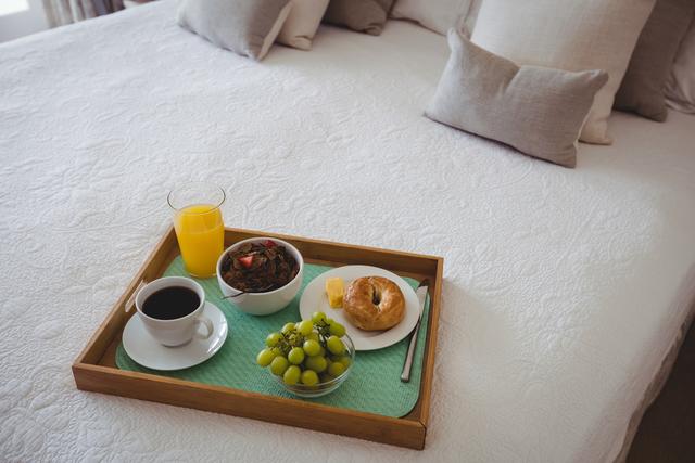 Breakfast tray on bed in bedroom - Download Free Stock Photos Pikwizard.com