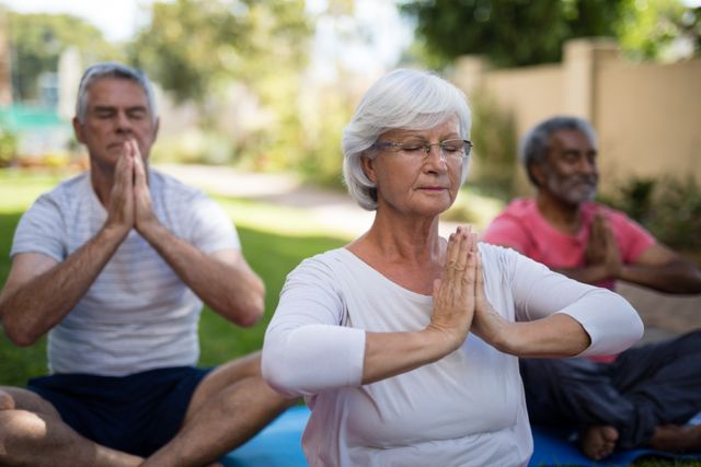 Senior people with closed eyes meditating in prayer position - Download Free Stock Photos Pikwizard.com