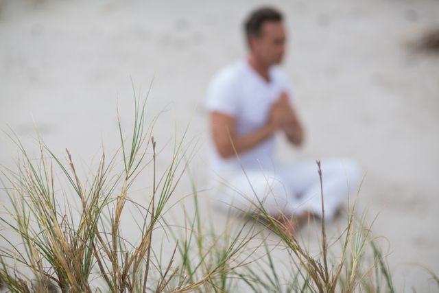 Mature man doing meditation - Download Free Stock Photos Pikwizard.com