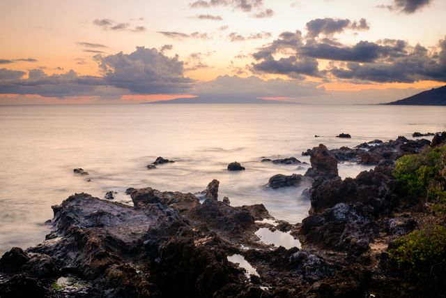 Cloudy Sunset over Ocean and Rocky Shore Time Lapse Photo - Download Free Stock Photos Pikwizard.com