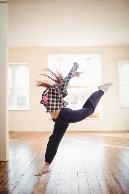 Young woman practising hip hop dance - Download Free Stock Photos Pikwizard.com