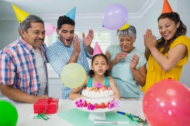 Happy multigeneration family celebrating birthday party - Download Free Stock Photos Pikwizard.com
