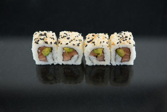 Sushi on black background - Download Free Stock Photos Pikwizard.com