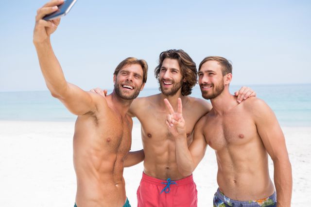 Smiling male friends taking selfie - Download Free Stock Photos Pikwizard.com