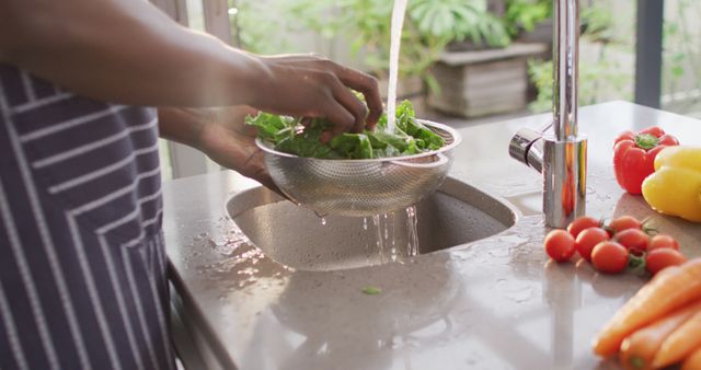 Image of hands of asian woman washing vegetables. Lifestyle and spending time at home concept.