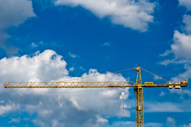Blue sky clouds construction crane - Download Free Stock Photos Pikwizard.com