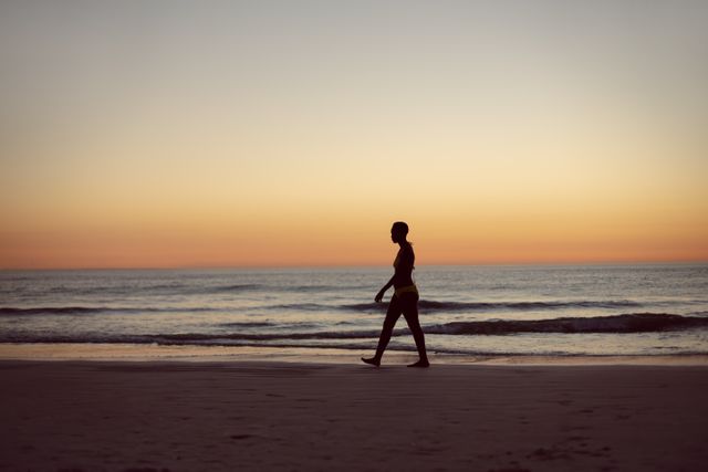 Woman in bikini walking on the beach - Download Free Stock Photos Pikwizard.com