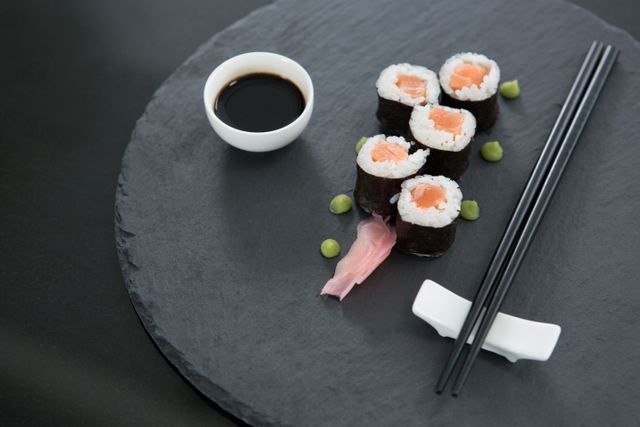 Sushi on tray with soy sauce and chopsticks - Download Free Stock Photos Pikwizard.com