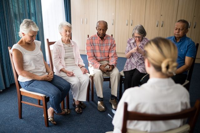Senior people meditating with female doctor - Download Free Stock Photos Pikwizard.com