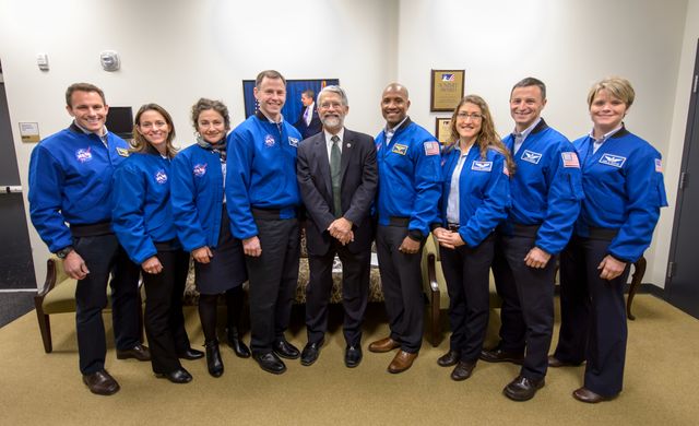 Dr. John P. Holdren, Assistant to the President for Science and Technology and Director of the White House Office of Science & Technology Policy, center, poses for a group photograph with NASA's 2013 astronaut candidates, from left, Josh A. Cassada, Nicole Aunapu Mann, Jessica U. Meir, Tyler N. "Nick" Hague, Holdren, Victor J. Glover, Christina M. Hammock, Andrew R. Morgan, and, Anne C. McClain at the annual White House State of Science, Technology, Engineering, and Math (SoSTEM) address, Wednesday, Jan. 29, 2014, in the South Court Auditorium in the Eisenhower Executive Office Building on the White House complex in Washington. Photo Credit: (NASA/Bill Ingalls)