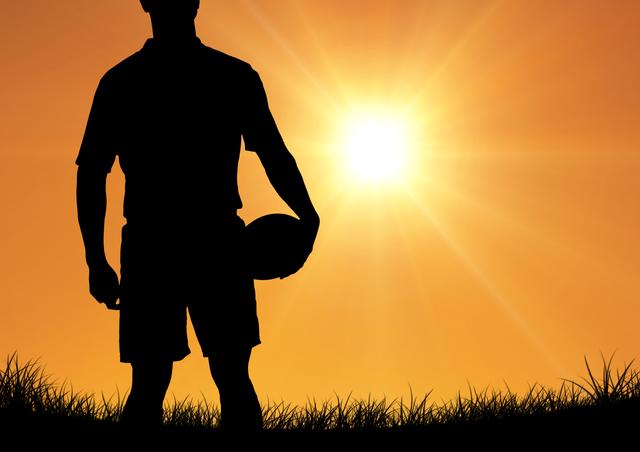 Silhouette of athlete standing with rugby ball - Download Free Stock Photos Pikwizard.com