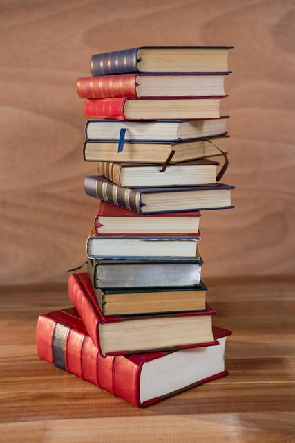 Stack of various books on a table - Download Free Stock Photos Pikwizard.com