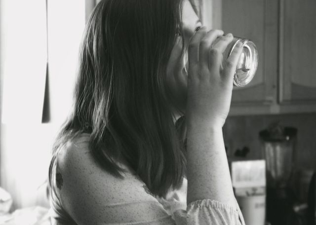 Grayscale Photo of Lady Drinking Water - Download Free Stock Photos Pikwizard.com