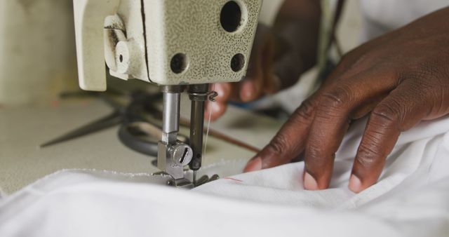 Hands of african american male tailor using sewing machine in workshop - Download Free Stock Photos Pikwizard.com