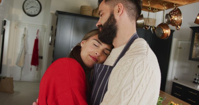 Image of happy caucasian couple hugging in the kitchen - Download Free Stock Photos Pikwizard.com