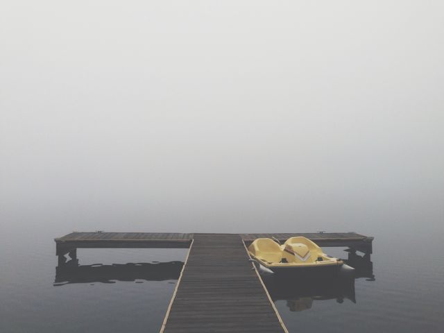 Black T Shaped Dock With a Boat at the Side during a Foggy Weather - Download Free Stock Photos Pikwizard.com
